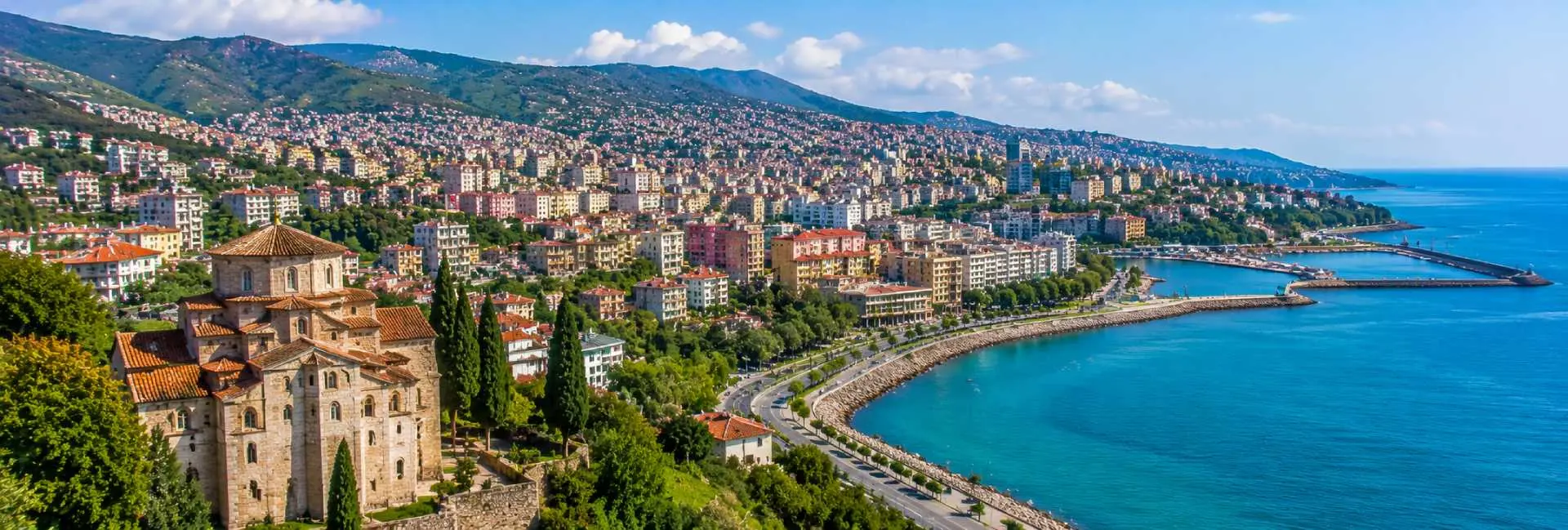 Hagia Sophia of Trabzon overlooking the lush Black Sea city and coastline in Türkiye