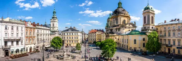 Lviv, Ukraine historic city center with colorful buildings, churches, and a lively cobblestone square