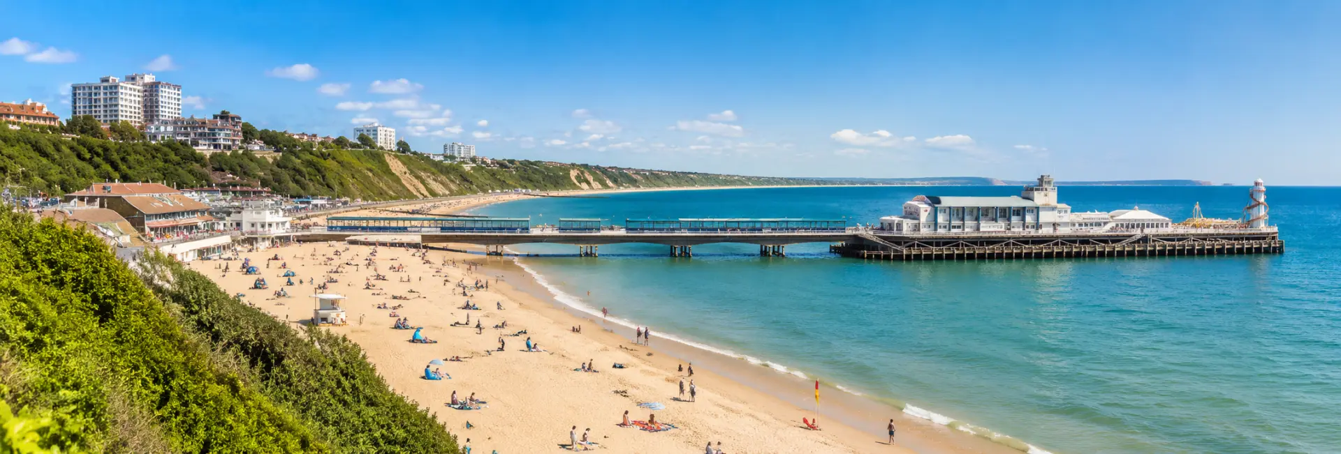 Bournemouth Beach and iconic pier along the sunny Dorset coastline in England