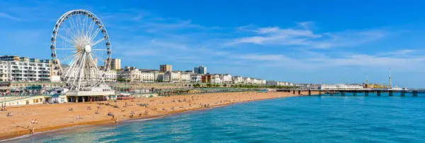 Brighton, UK panoramic view of Brighton Pier, beach, seafront and English Channel