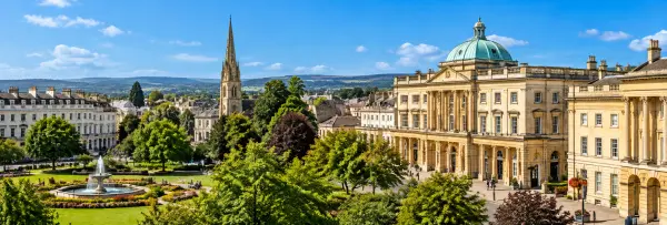 Cheltenham, United Kingdom skyline with elegant Regency buildings, gardens and Cotswold hills