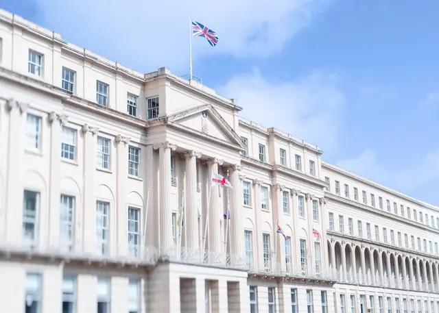 Cheltenham Town Hall with Union Jack flags and elegant classical architecture
