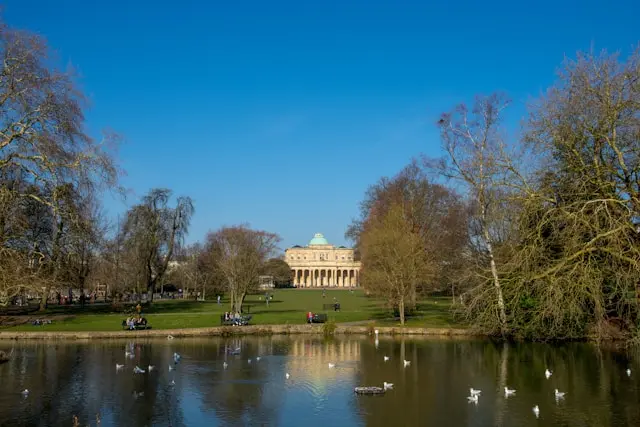 Pittville Pump Room overlooking the lake in Cheltenham's scenic Pittville Park