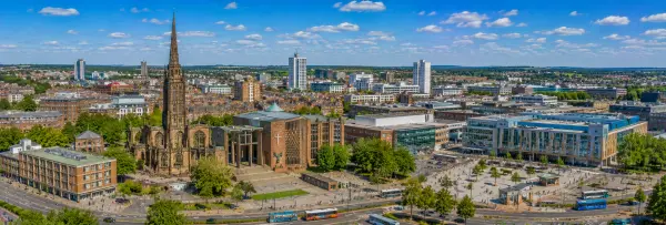 Coventry, United Kingdom skyline with historic cathedral, modern city centre and surrounding landscape