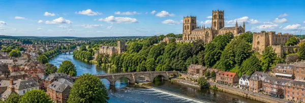 Durham, United Kingdom cityscape with Durham Cathedral, castle, River Wear and historic bridges