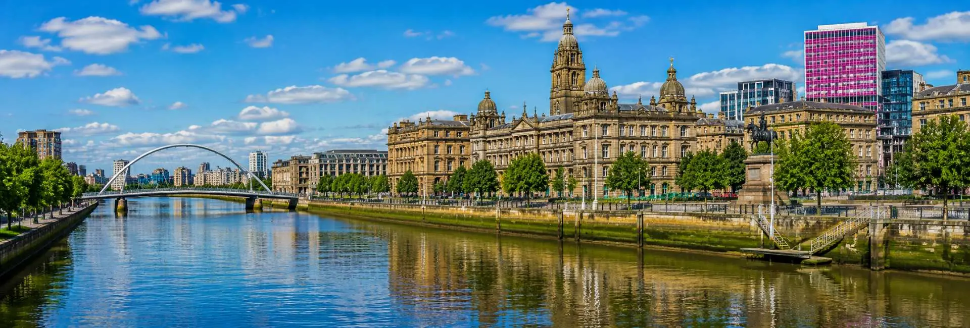 Glasgow City Chambers and River Clyde with historic and modern architecture in Glasgow, UK