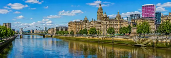 Glasgow City Chambers and River Clyde with historic and modern architecture in Glasgow, UK