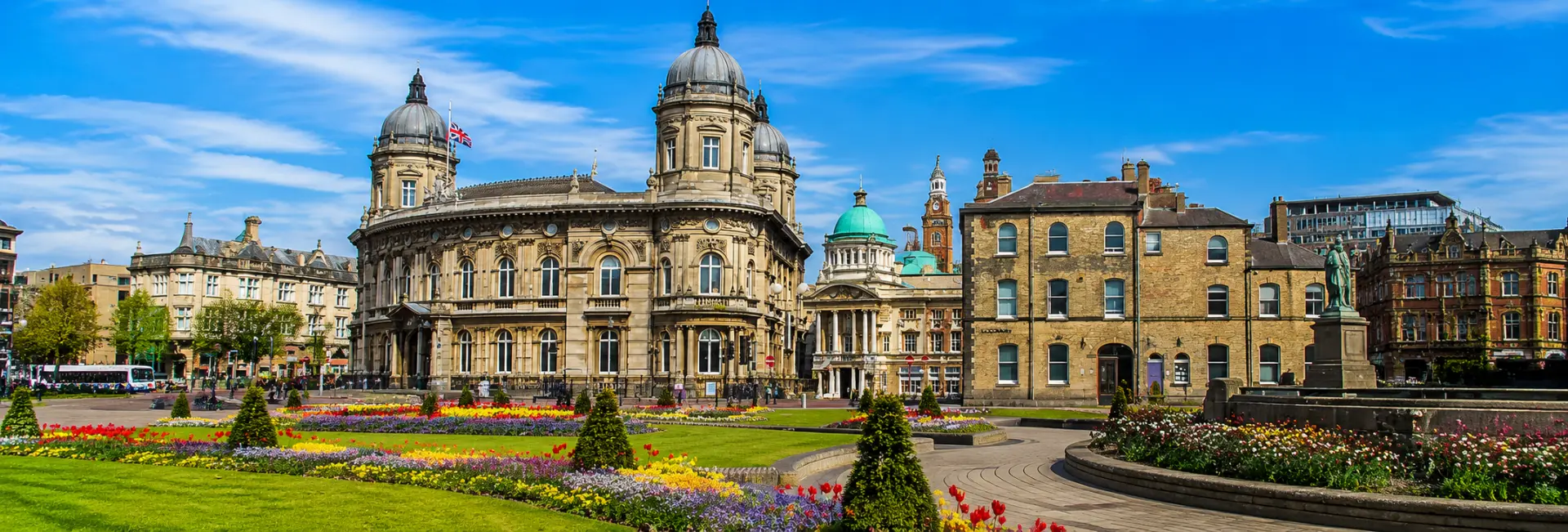 Kingston upon Hull, United Kingdom, with Hull City Hall and colorful flower gardens in Queen Victoria Square