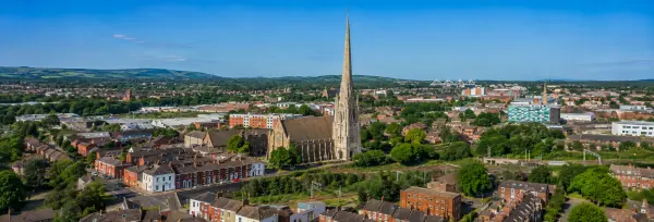 Aerial panoramic view of Preston, United Kingdom, featuring St Walburge’s Church and its tall Gothic spire