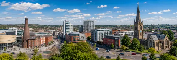 Stoke-on-Trent, United Kingdom skyline with historic buildings, church spire, and urban streets