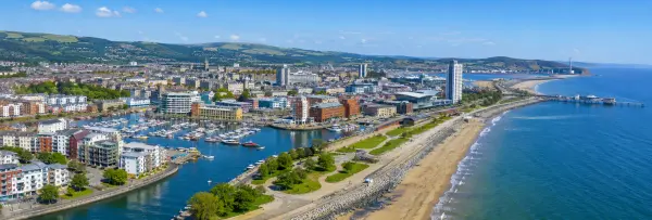 Swansea, United Kingdom coastal skyline, marina, beaches and surrounding green hills